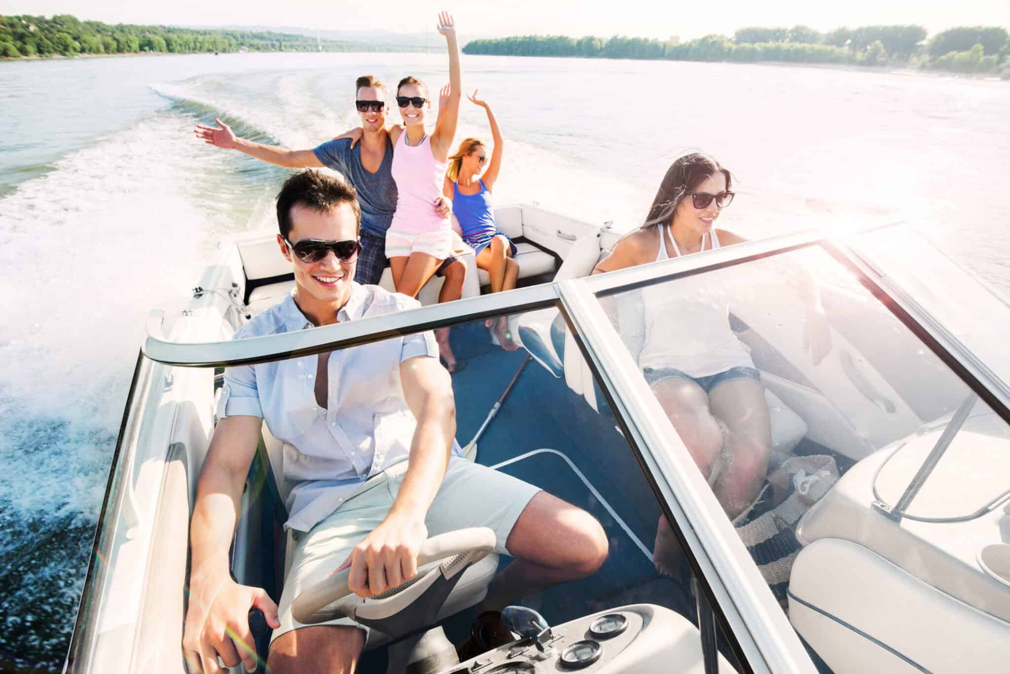 Cheerful group of people enjoying a boat ride.